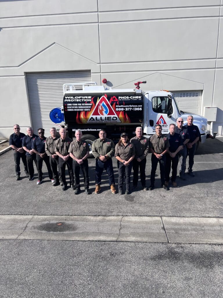 The Allied Disaster Defense field team standing in front of a response truck