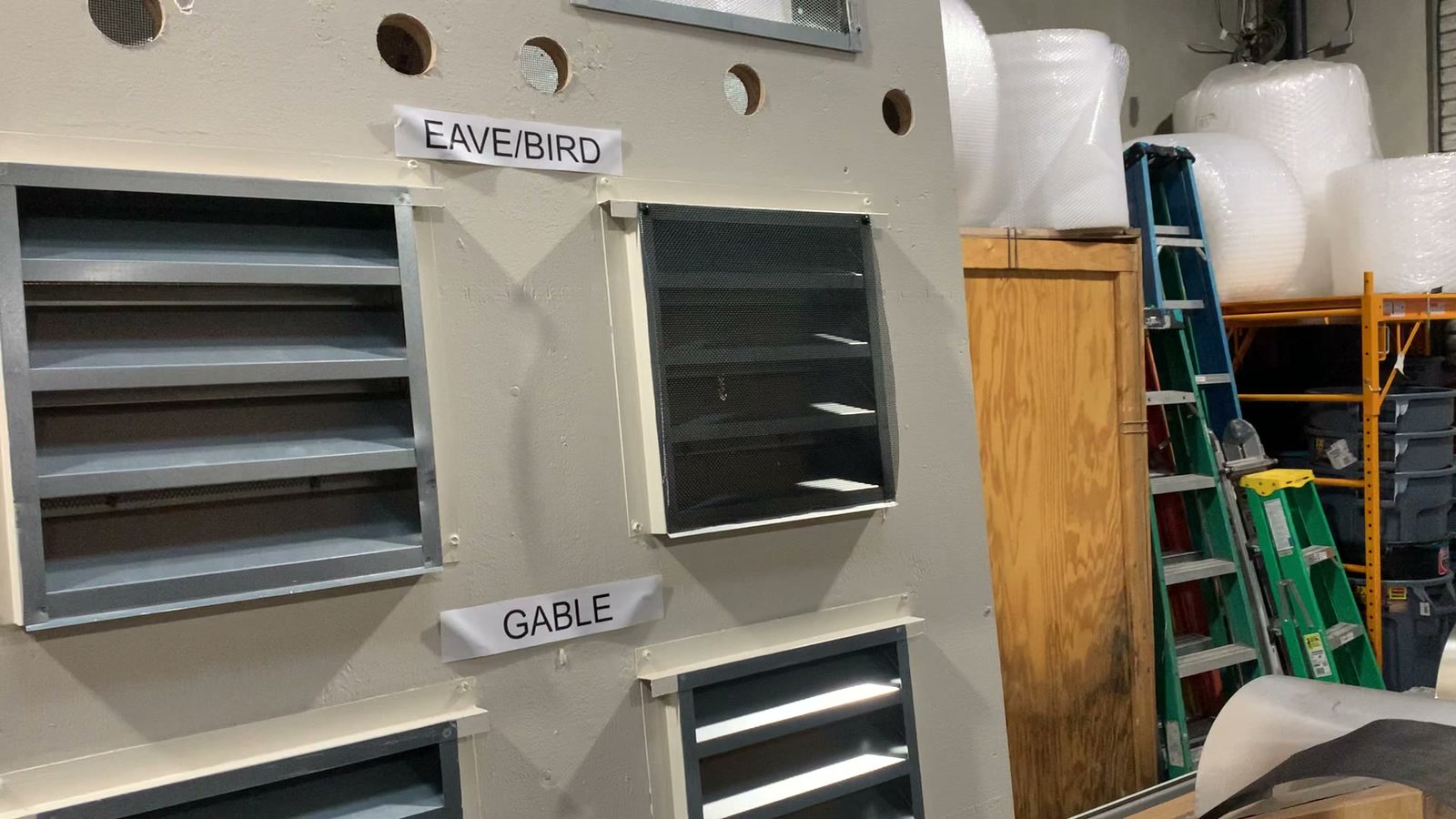 An Allied installer fitting an ember-resistant eave vent on the training board